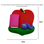 Red apple with pink book and purple worm teacher appreciation ornament, graphed to show size (5x5cm).