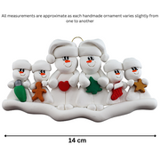 Family ornament with 2 large and 4 small snowmen in hats, holding holiday objects, graphed to show size (14cm).