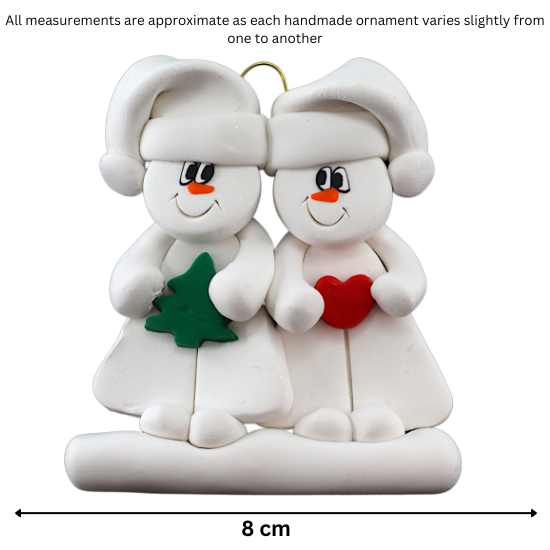 Family ornament with 2 white snowmen in hats, holding holiday objects, graphed to show size (8cm).