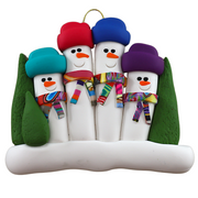 Family ornament with 4 snowmen in colourful scarves and hats, hemmed by Christmas trees.