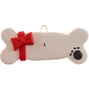 Ornament of dog bone with ribbon and paw print,numbered for personalization.