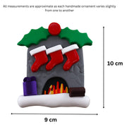 Vibrant fireplace ornament with holly and Christmas presents, displaying 3 red stockings, graphed to show size (9x10cm).