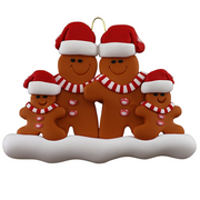 Family ornament with 4 brown gingerbread figures in red Christmas hats.