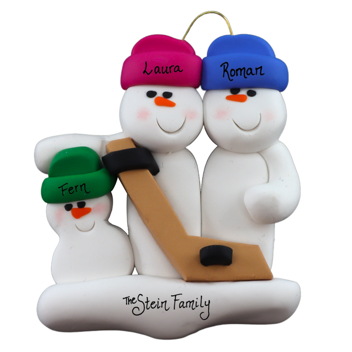 Family ornament with 3 white snowmen in bright hats, holding a hockey stick, personalized with names.