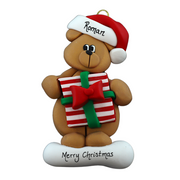 Tan bear in red festive hat holding colourful present ornament, personalized with name.