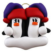 A couple’s ornament of two penguins in colourful hats.