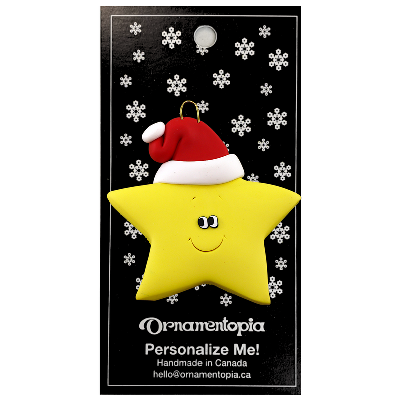 Yellow star in red Christmas hat ornament, on display backing card.