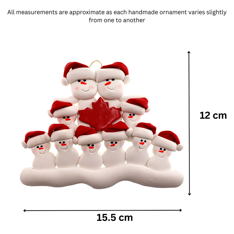 Family ornament with 10 white snowmen in red hats, gathered around a red maple leaf, graphed to show size (15.5x12cm).