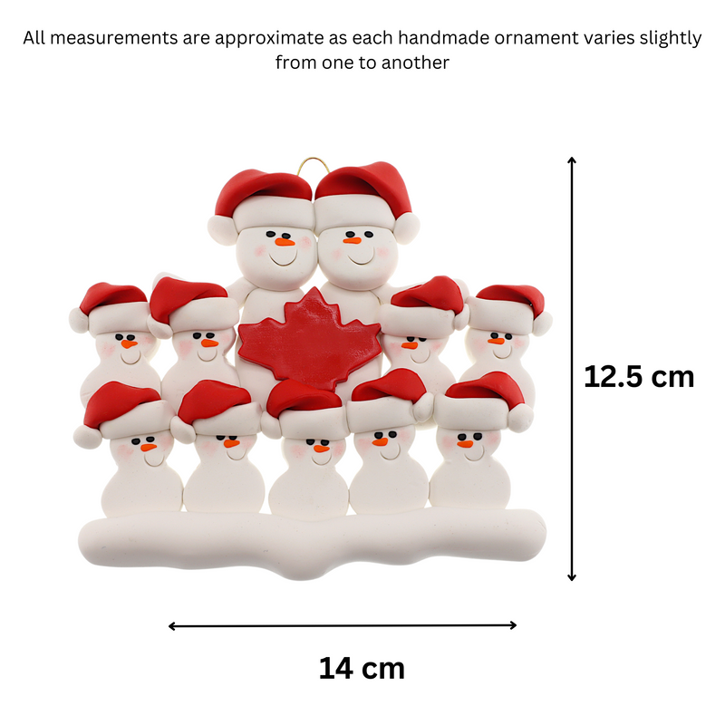 Family ornament with 11 white snowmen in red hats, gathered around a red maple leaf, graphed to show size (14x12.5cm).