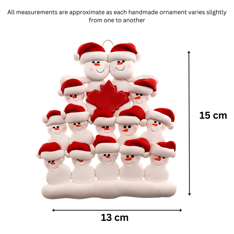 Family ornament with 14 white snowmen in red hats, gathered around a red maple leaf, graphed to show size (13x15cm).