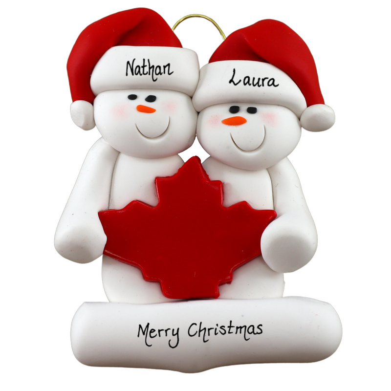 Family ornament with 2 white snowmen in red hats, gathered around a red maple leaf, personalized with names.