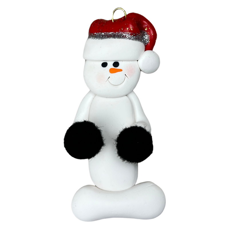 Ornament of white snowman in red hat holding black cheerleader pom-poms.