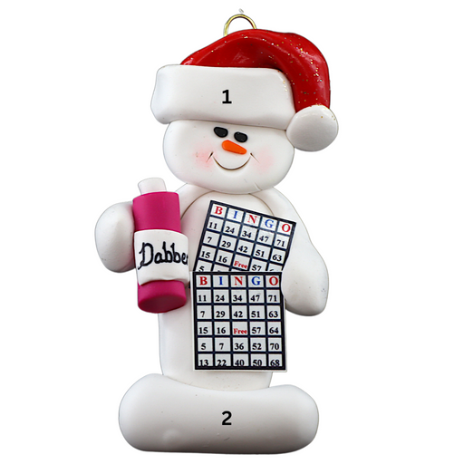 Ornament of white snowman in red hat holding a bingo card and dabber, numbered 1-2 for personalization.