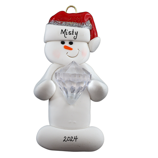 Ornament of white snowman in red hat holding large plastic diamond, personalized with name.
