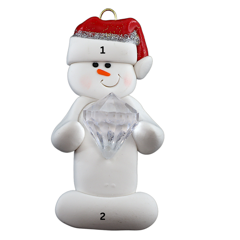 Ornament of white snowman in red hat holding large plastic diamond, numbered 1-2 for personalization.
