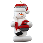 Ornament of white snowman in red hat holding red curling stone and broom.