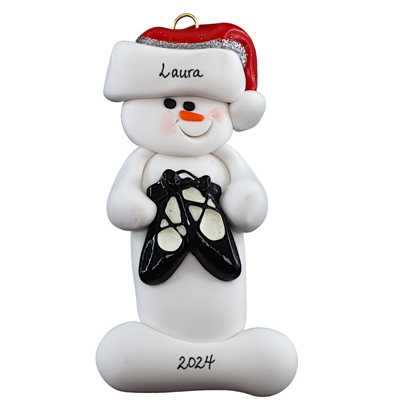 Ornament of white snowman in red hat holding black ballet shoes, personalized with name.