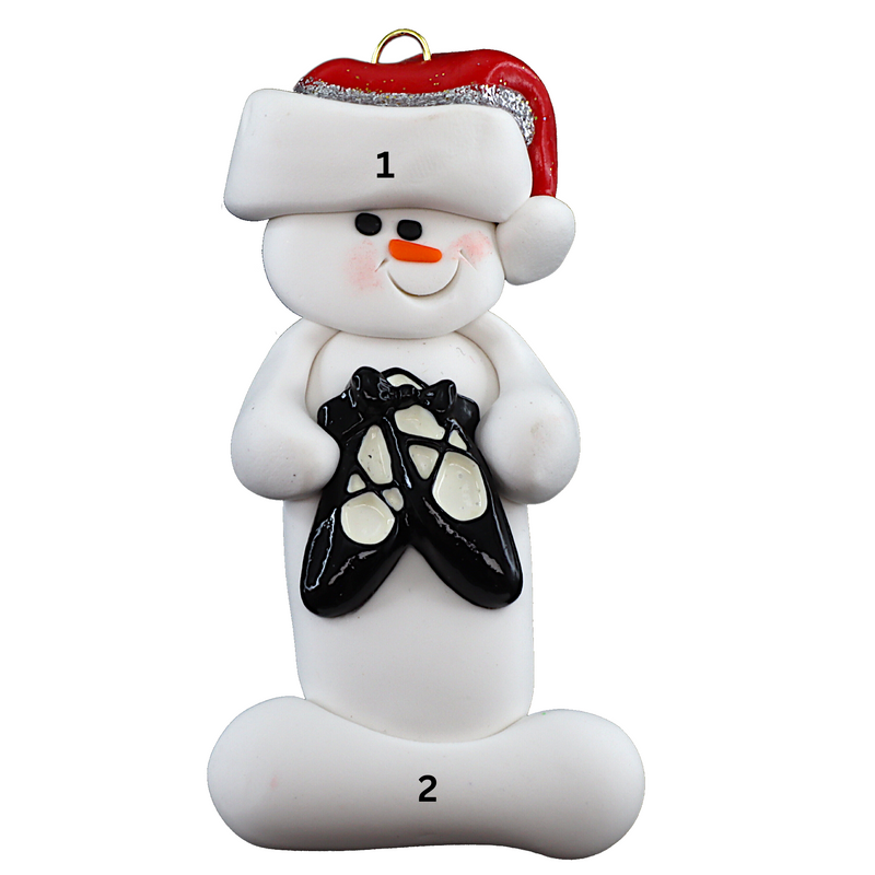 Ornament of white snowman in red hat holding black ballet shoes, numbered 1-2 for personalization.