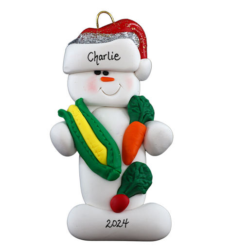 Ornament of white snowman in red hat holding various colourful vegetables, personalized with name.