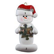 Ornament of white snowman in red hat holding a puzzle piece, numbered 1-2 for personalization.