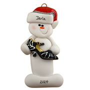 Ornament of white snowman in red hat holding a fancy shoe, personalized with name.