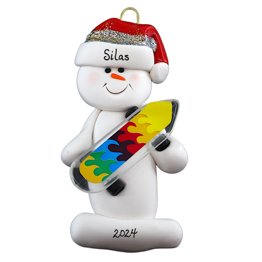 Ornament of white snowman in red hat holding a vibrant skateboard, personalized with name.