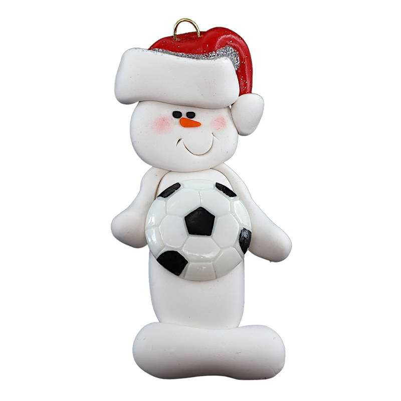Ornament of white snowman in red hat holding a soccer ball.
