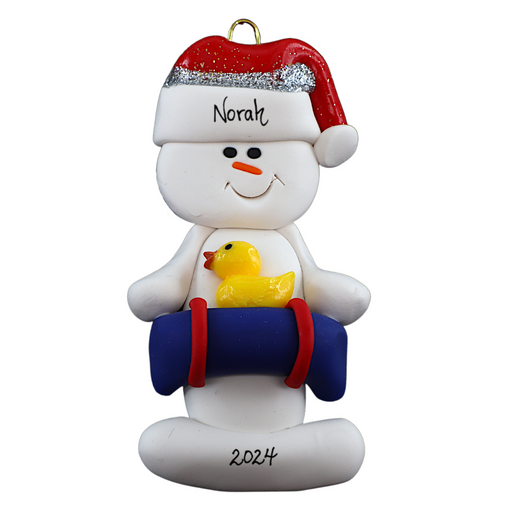 Ornament of white snowman in red hat holding a blue inflatable tube and yellow duck, personalized with name.