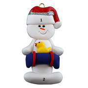 Ornament of white snowman in red hat holding a blue inflatable tube and yellow duck, numbered 1-2 for personalization.