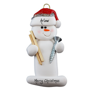 Ornament of white snowman in red hat holding a piece of wood and a screw, personalized with name.