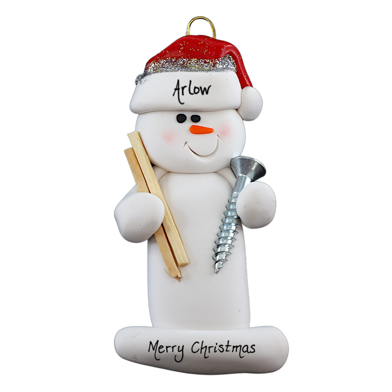 Ornament of white snowman in red hat holding a piece of wood and a screw, personalized with name.