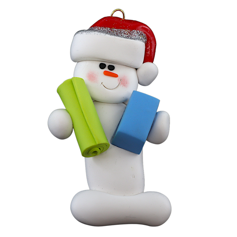 Ornament of white snowman in red hat holding vibrant yoga mat and block.