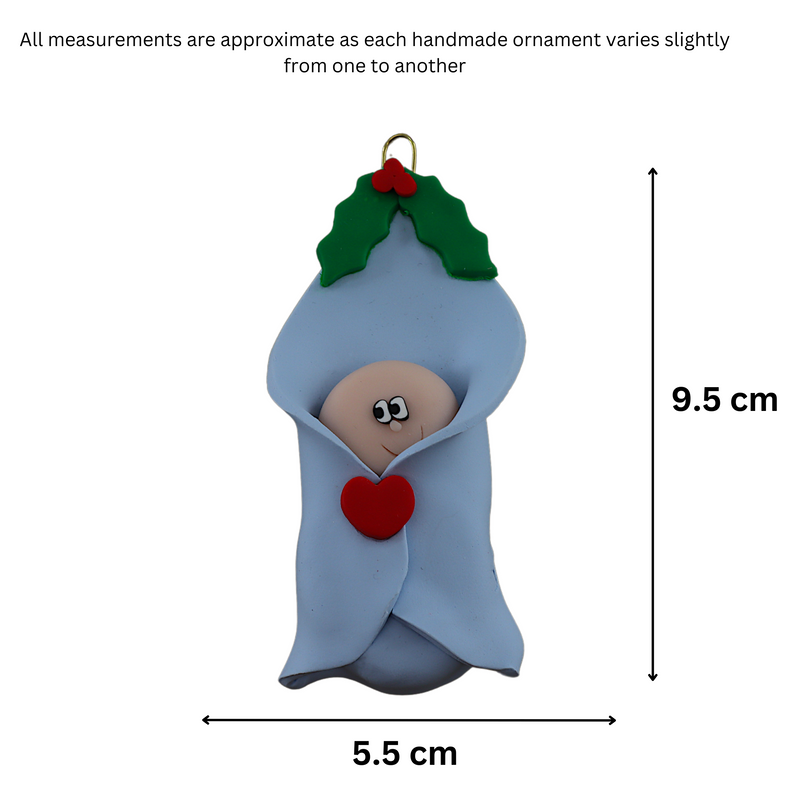 Ornament with infant head poking out of a blue baby blanket, graphed to show size (5.5x9.5cm).