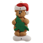 Tan bear in red festive hat holding green tree ornament, numbered 1-2 for personalization.