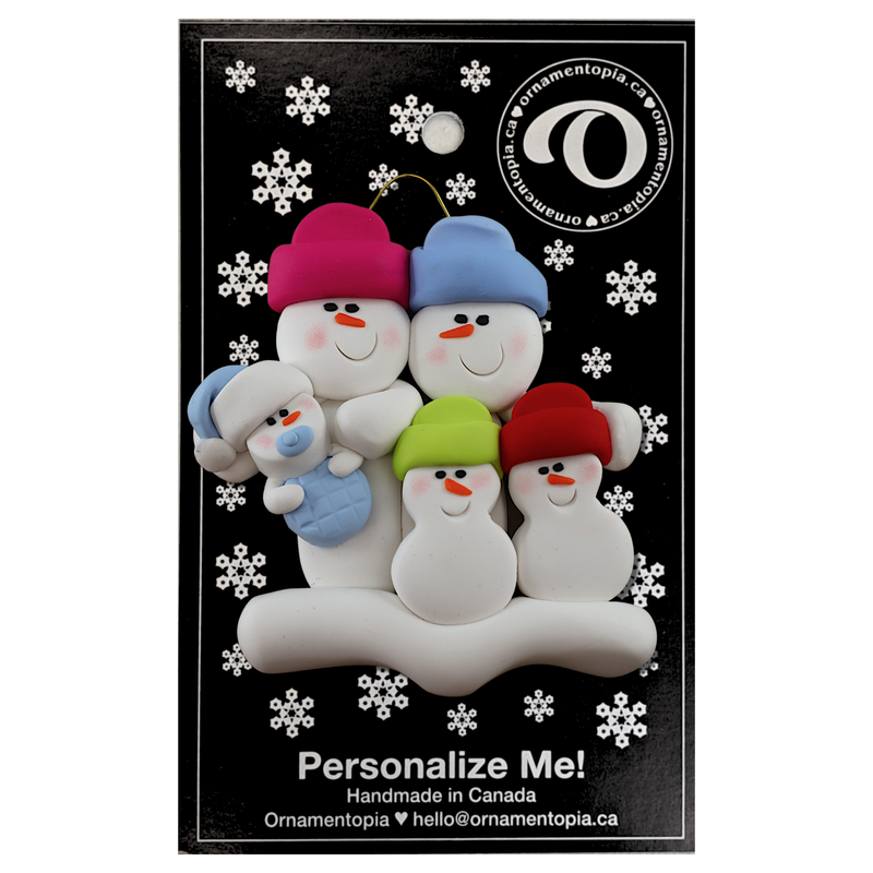 Family ornament with 2 large, 2 small, and 1 infant snowman in blue, on display backing card.
