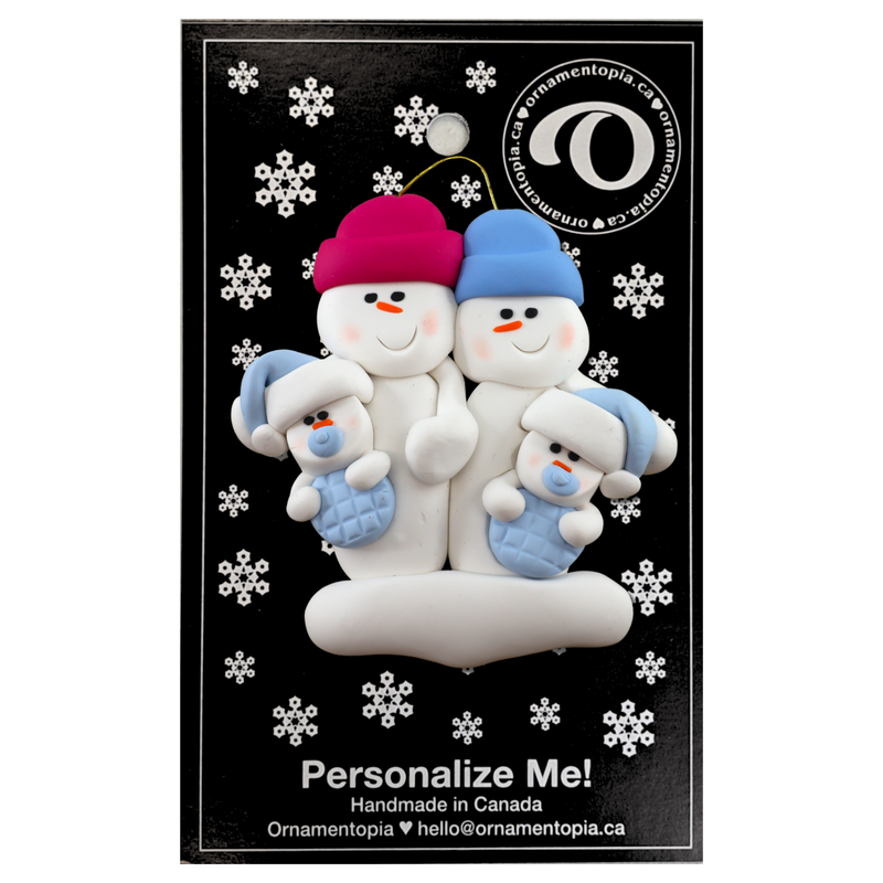 Family ornament with 2 large and 2 infant snowmen in blue, on display backing card.