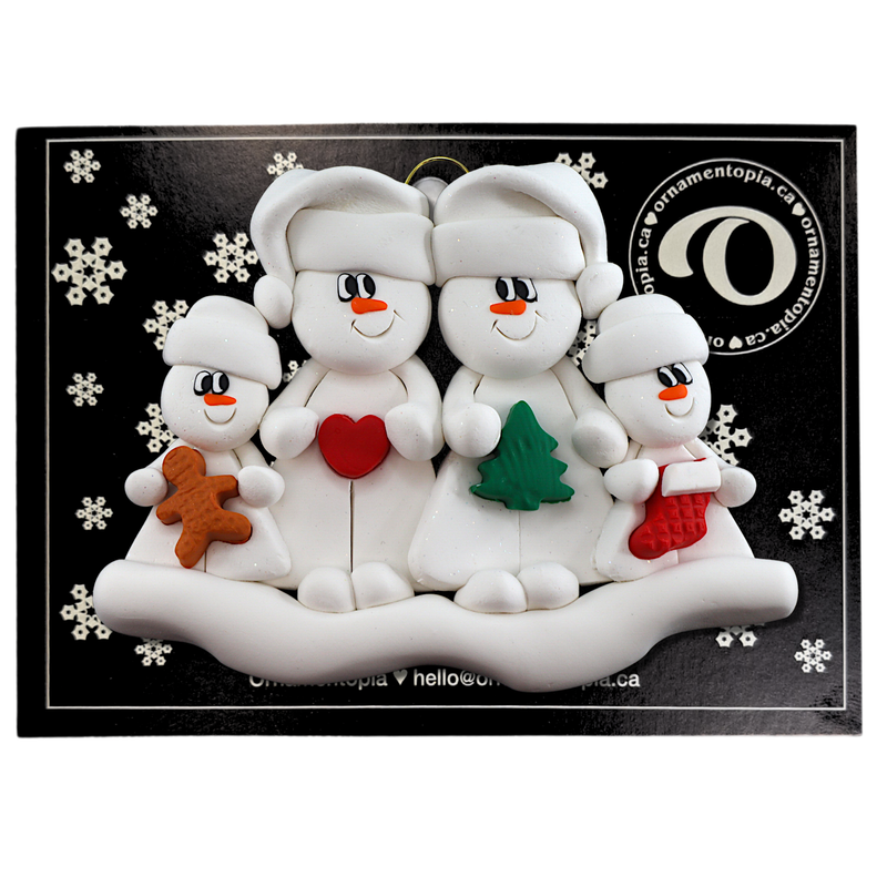 Family ornament with 2 large and 2 small snowmen in hats, holding holiday objects, on display backing card.