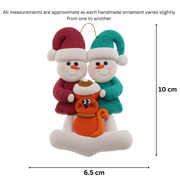 Ornament of snowman couple in red and green shirts and hats with a orange cat in Christmas hat, graphed to show size (6.5x10cm).