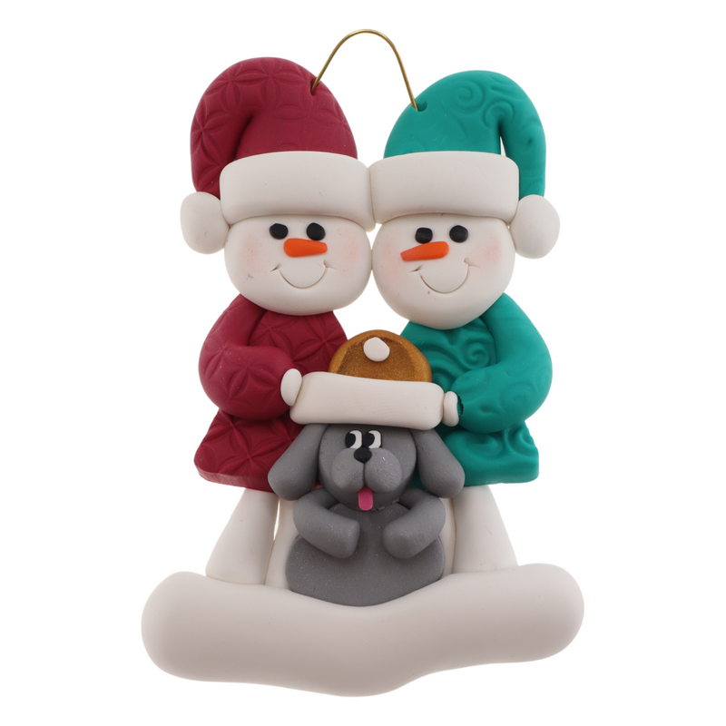 Ornament of snowman couple in red and green shirts and hats with grey dog in Christmas hat.