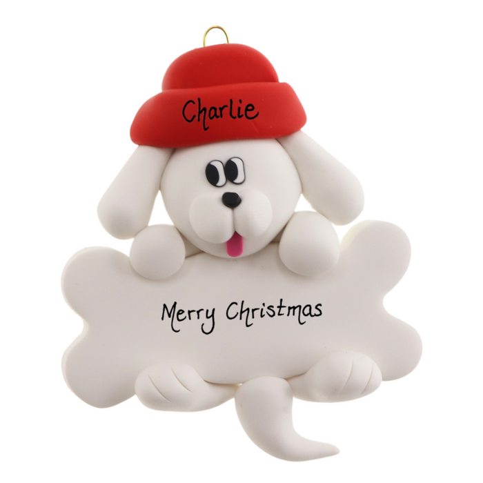 Ornament of white dog in red hat hanging on a white bone, personalized with names.
