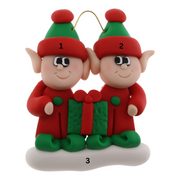 A couple’s ornament with two small red and green elves with a matching present, numbered 1-3 for personalization.