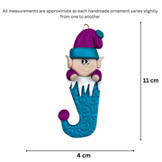 Elf poking out of blue stocking ornament, graphed to show size (4x11cm).