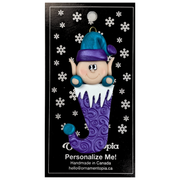 Elf poking out of purple stocking ornament, on display backing card.