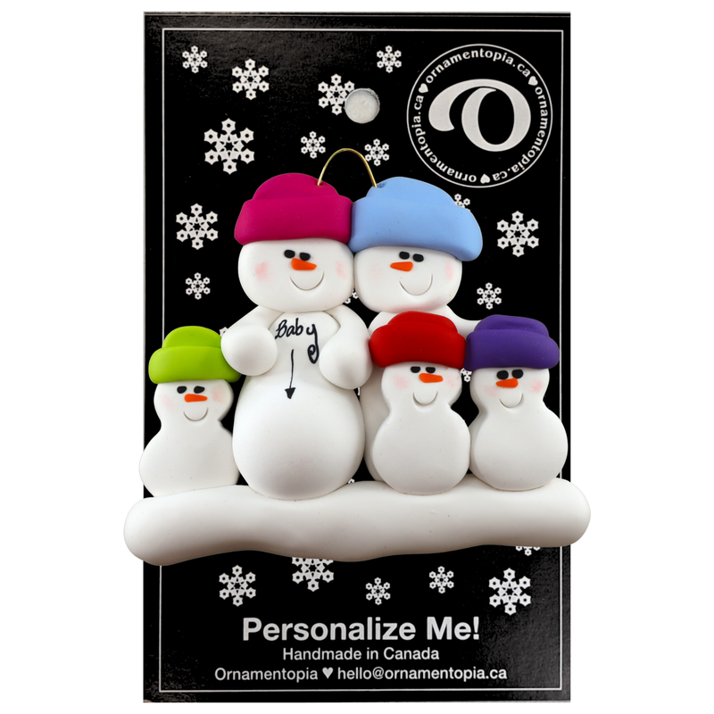 Family ornament with 5 snowmen in bright hats, one pregnant, on display backing card.