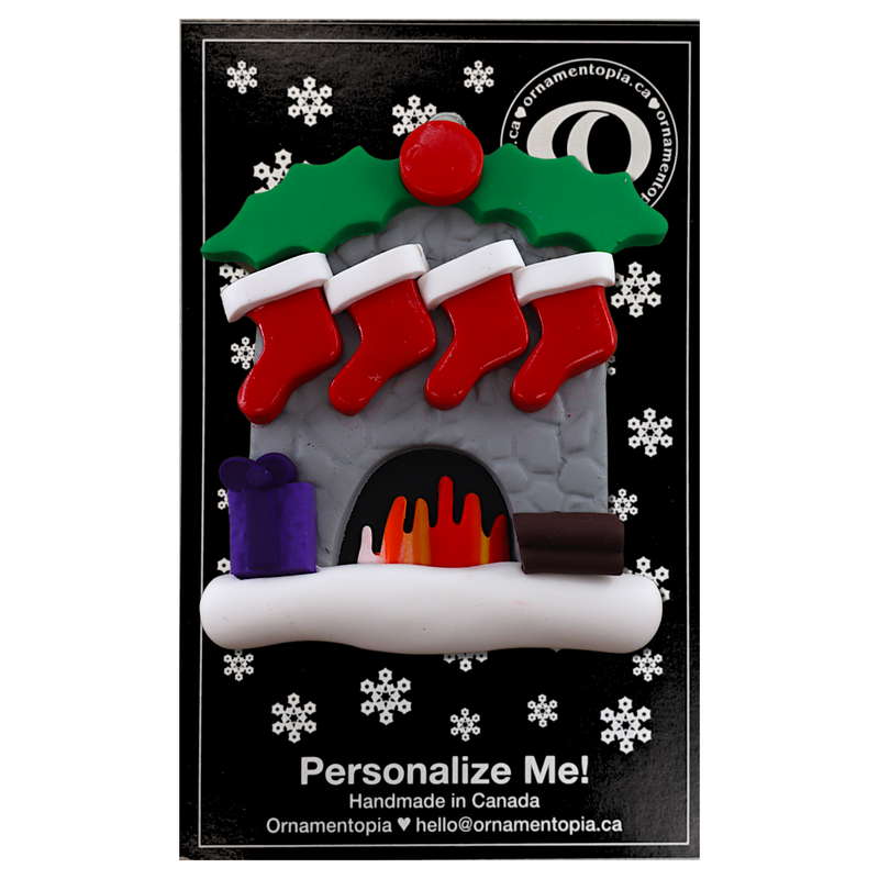 Vibrant fireplace ornament with holly and Christmas presents, displaying 4 red stockings, on display backing card.