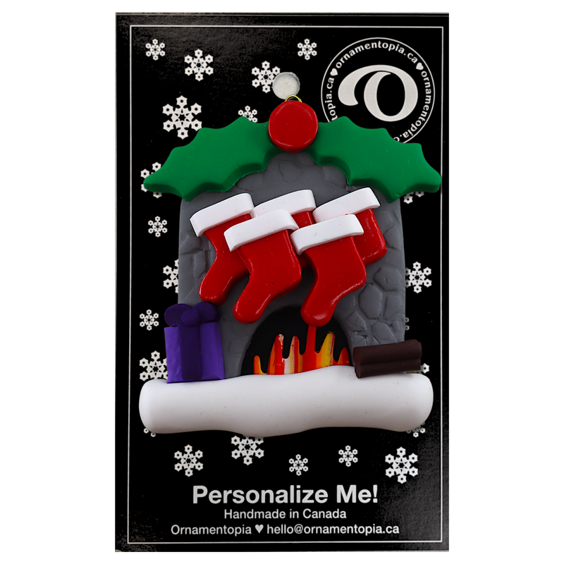 Vibrant fireplace ornament with holly and Christmas presents, displaying 5 red stockings, on display backing card.