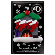 Vibrant fireplace ornament with holly and Christmas presents, displaying 6 red stockings, on display backing card.