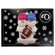 Family ornament with 2 white snowmen in bright hats with a football, on display backing card.