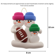 Family ornament with 3 white snowmen in bright hats with a football, graphed to show size (8x10cm).