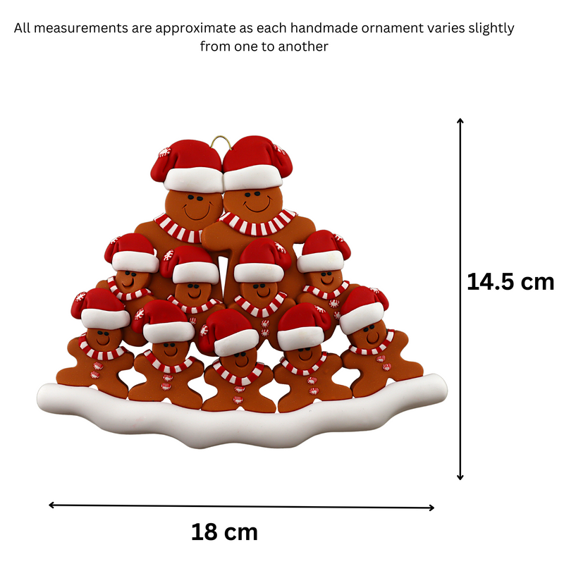Family ornament with 11 brown gingerbread figures in red Christmas hats, graphed to show size (18x14.5cm).